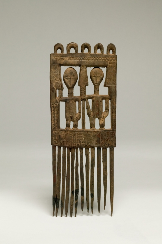 Comb with Two Standing Figures