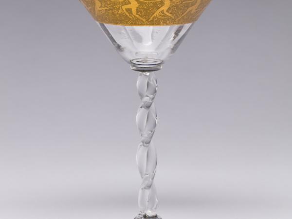 Cocktail glass with twisted stem and gold encrusted etch.