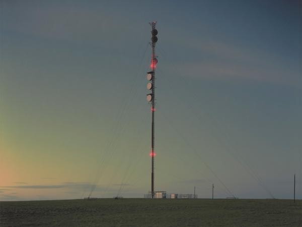 Power lines in the middle of a flat landscape