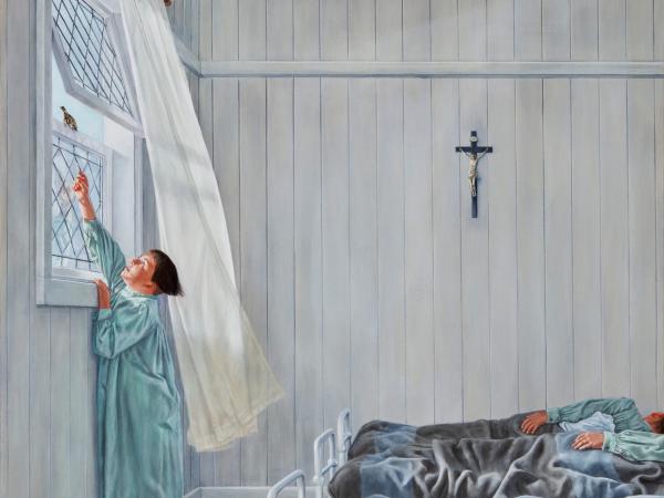 Young boy reaching up to a bird in the windowsill