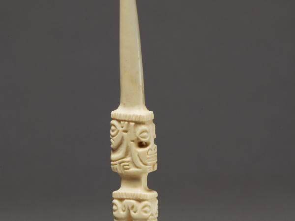 Small pointed object resembling a knife made out of whale ivory