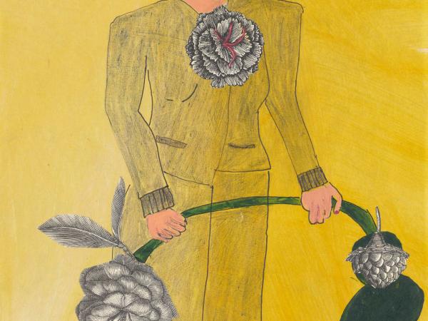 Man in yellow holding the stem of a large flower