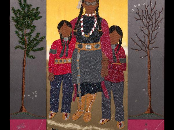 Indigenous mother and her son and daughter under the sun and in nature