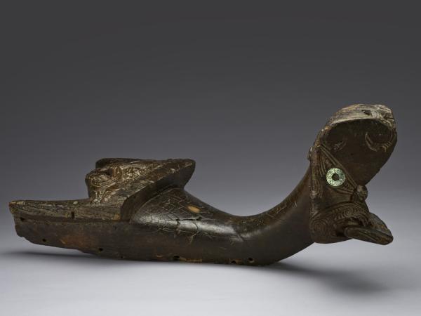 Wooden head of canoe carved with symbolic embroiderings