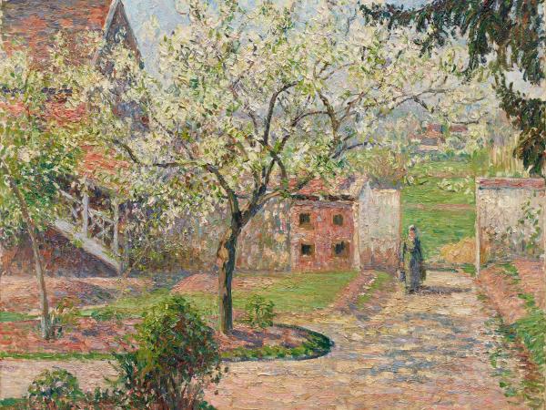 Woman strolling through a private garden outside her home